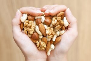 image of a person holding nuts with both hands